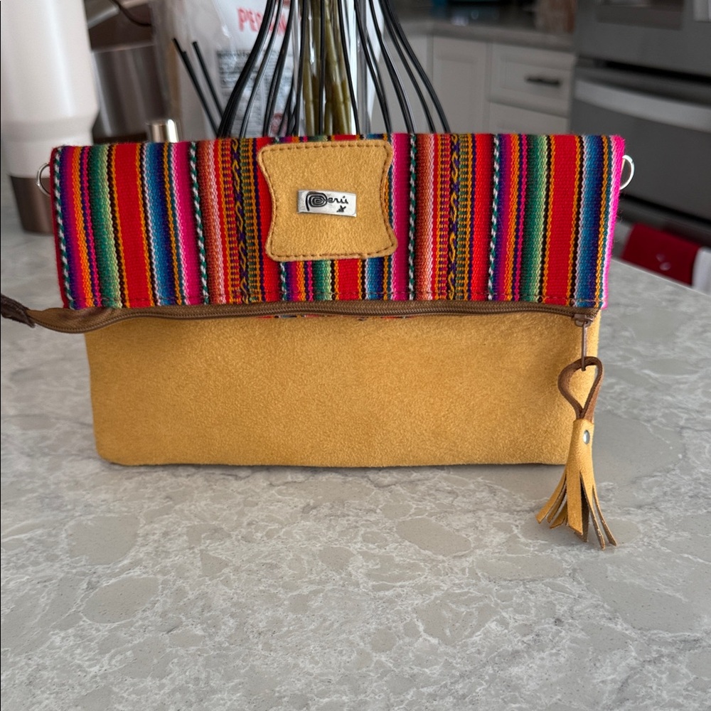 Peruvian foldover clutch bag with a colorful rainbow-striped
